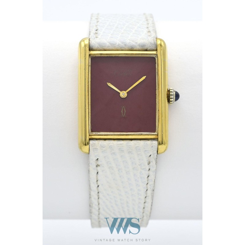 CARTIER (TANK HOMME MUST DE CARTIER / ROUGE CERISE  numéroté), vers