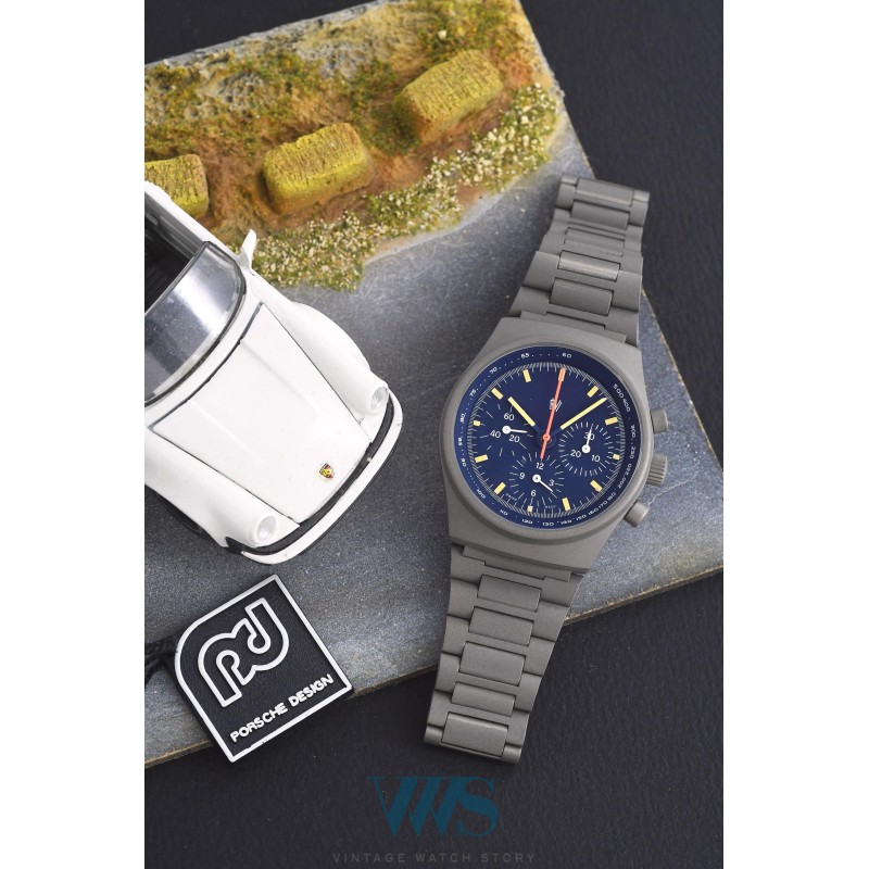 PRESTIGE WATCH INTERNATIONAL (Chronographe By Orfina Suisse, Gris "Logo only" - Cadran bleu / réf. 7183D), vers 1980