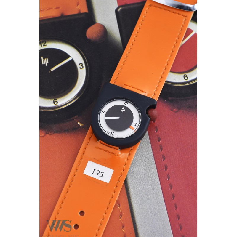 LIP (Design by Roger Tallon - Ecusson Black / Bracelet Orange / ref. 43310), vers 1975/76